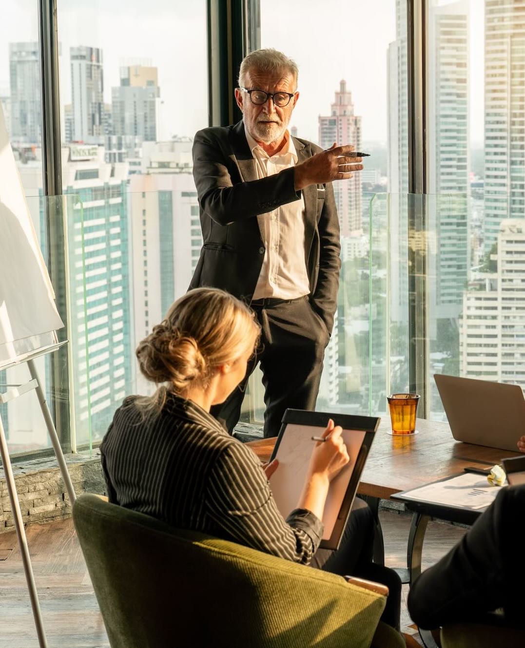 Business man presenting in front of his employees 